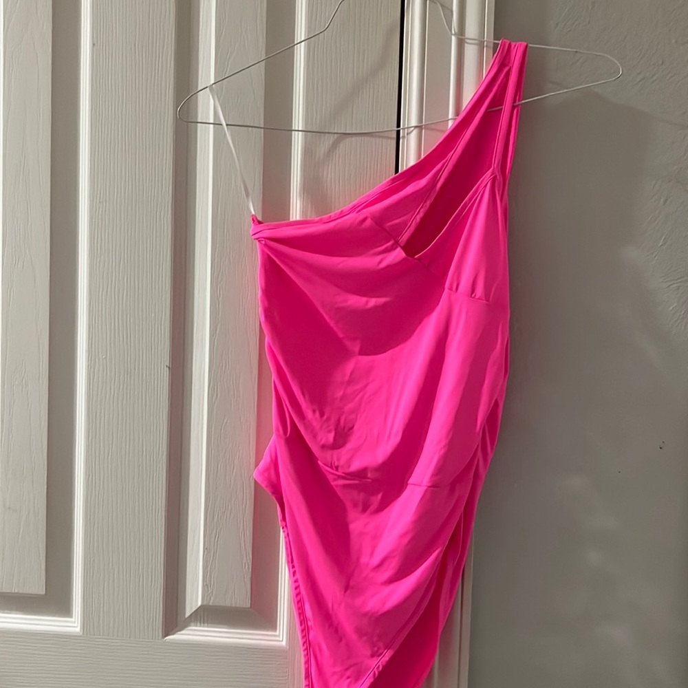 One shoulder, hot pink body suit